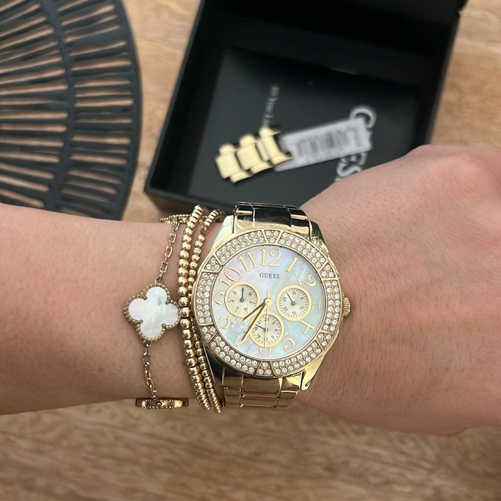 Guess women’s gold watch. (Needs battery changed).